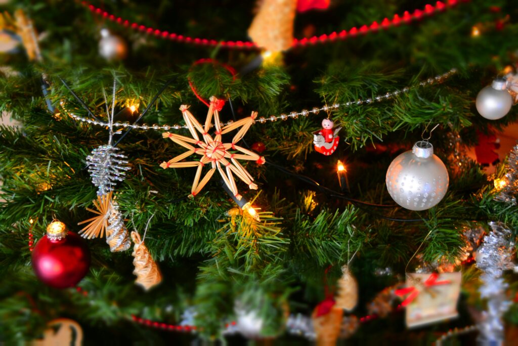 Christmas Close-up of a decorated Christmas tree with lights and ornaments, showcasing holiday spirit.