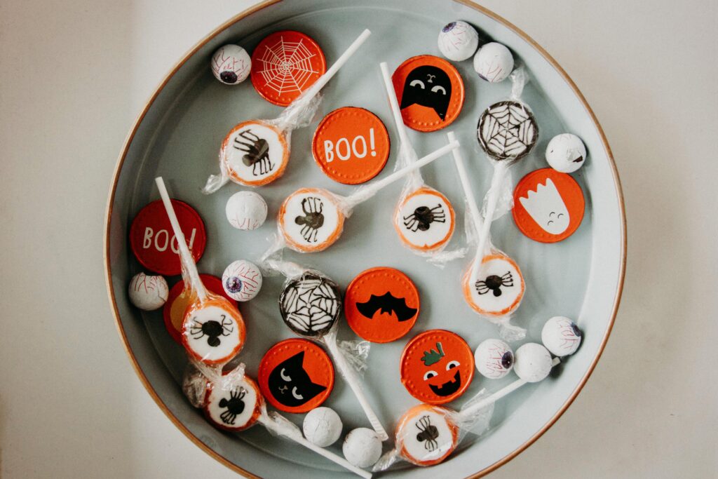 Halloween A vibrant assortment of Halloween-themed candies in a bowl, perfect for seasonal celebrations.